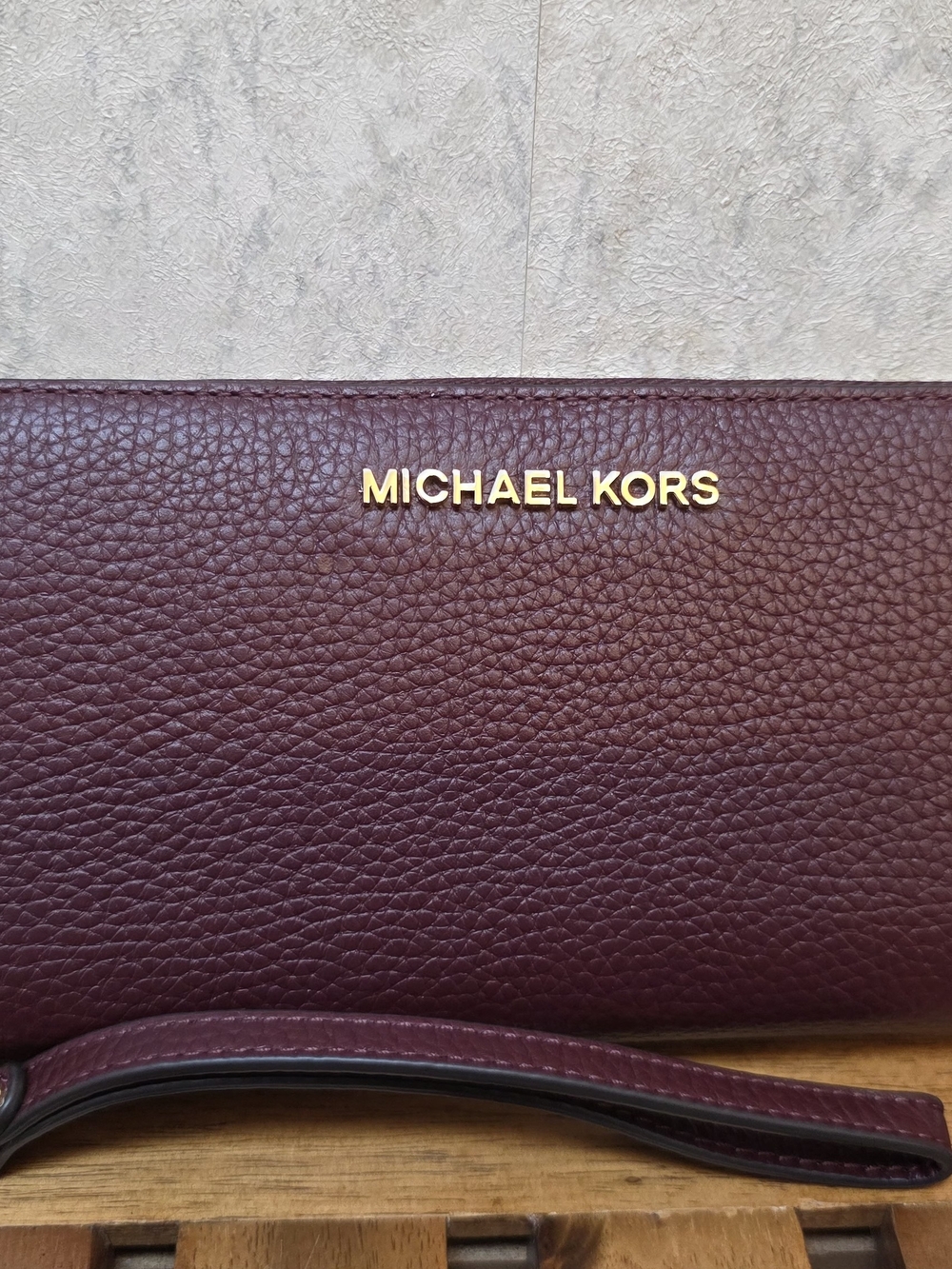 Michael Kors Burgundy Pebbled Leather Wristlet with Gold Logo